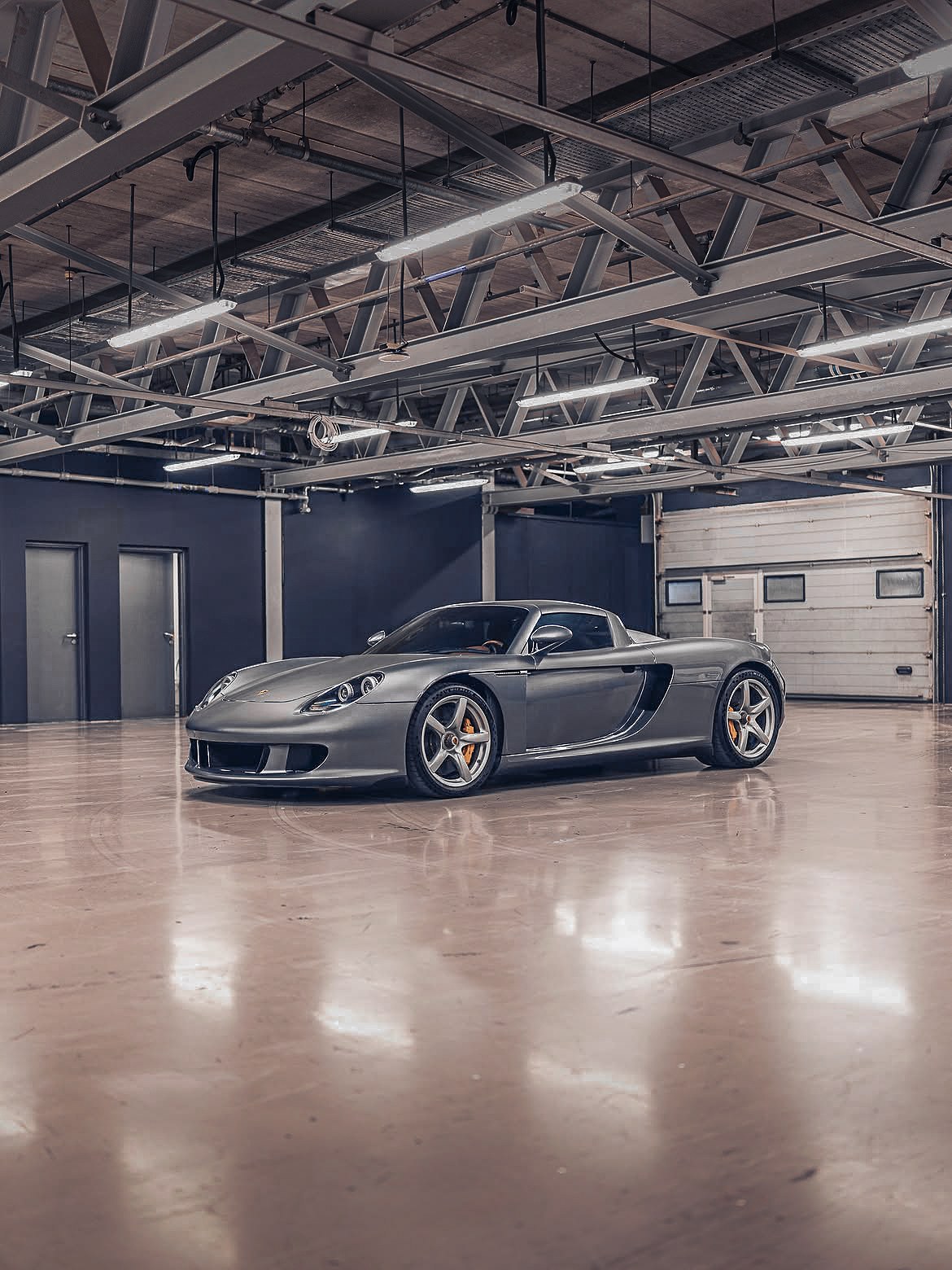 Porsche Carrera GT in an empty showroom