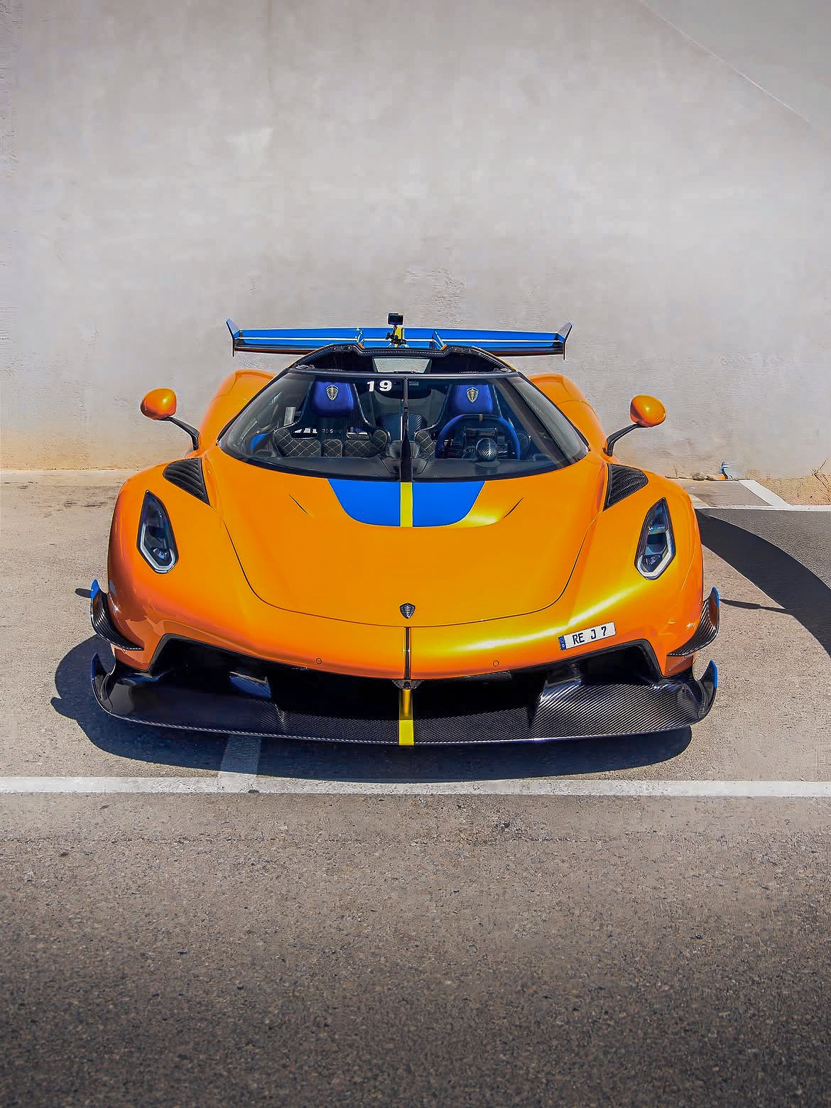 Orange Lamborghini Huracan STO in a warehouse
