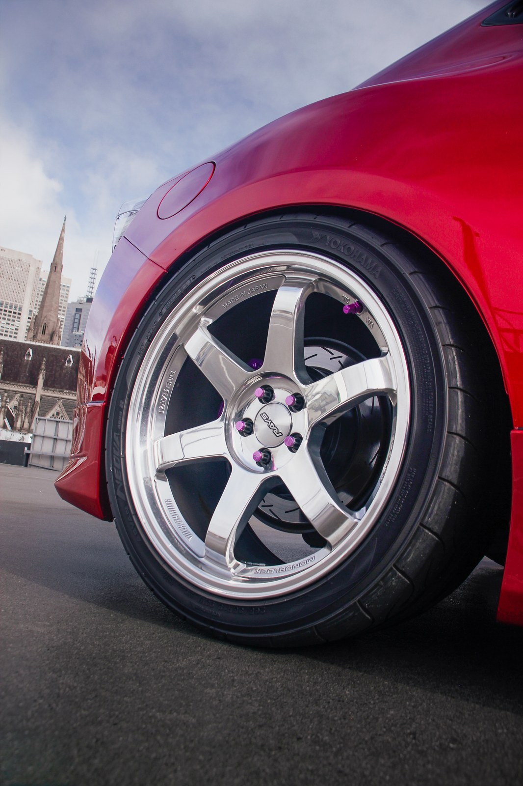 Close-up of a polished wheel on a red sports car